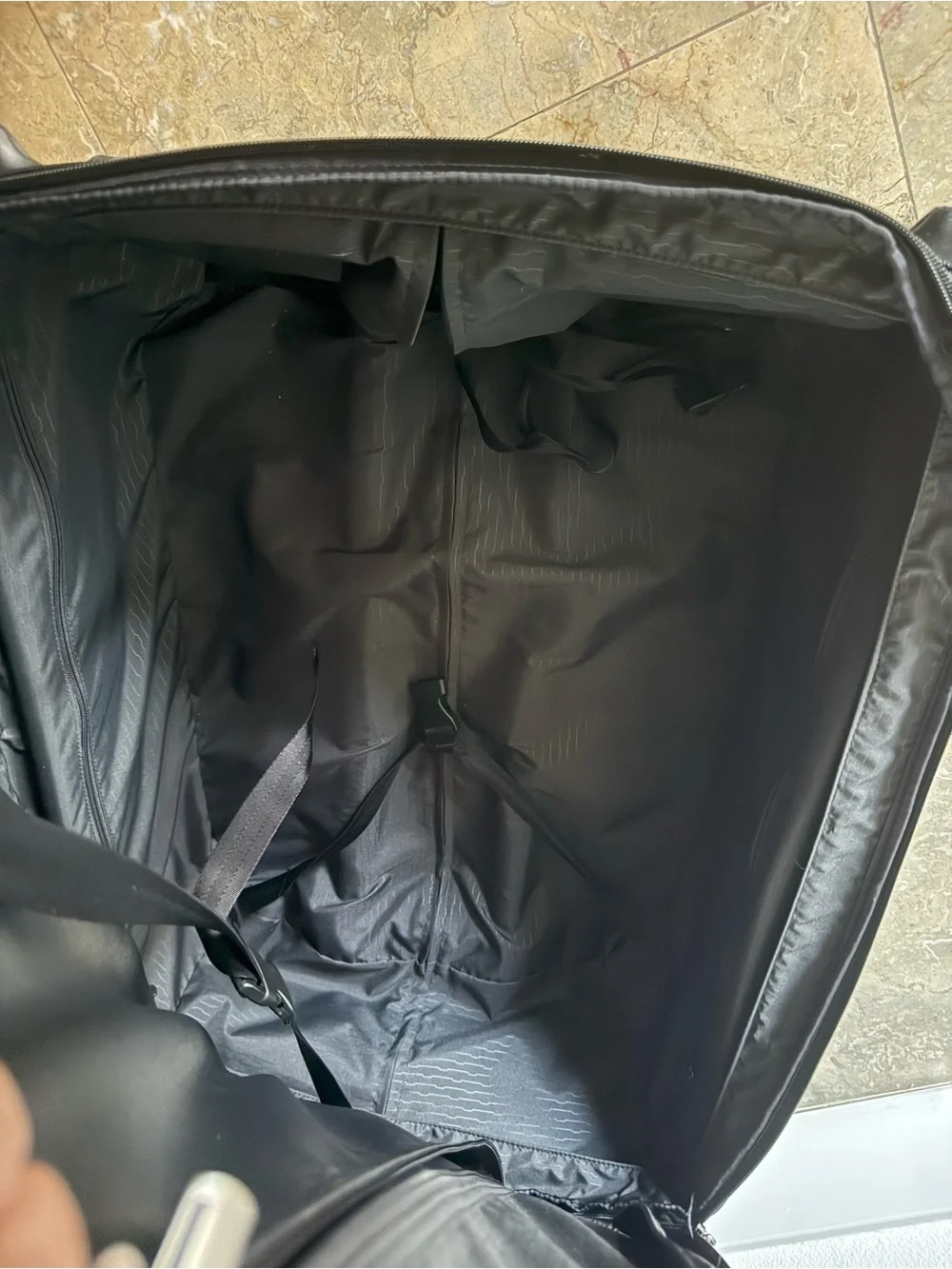 Tumi Black and Gray Rolling Carry-On